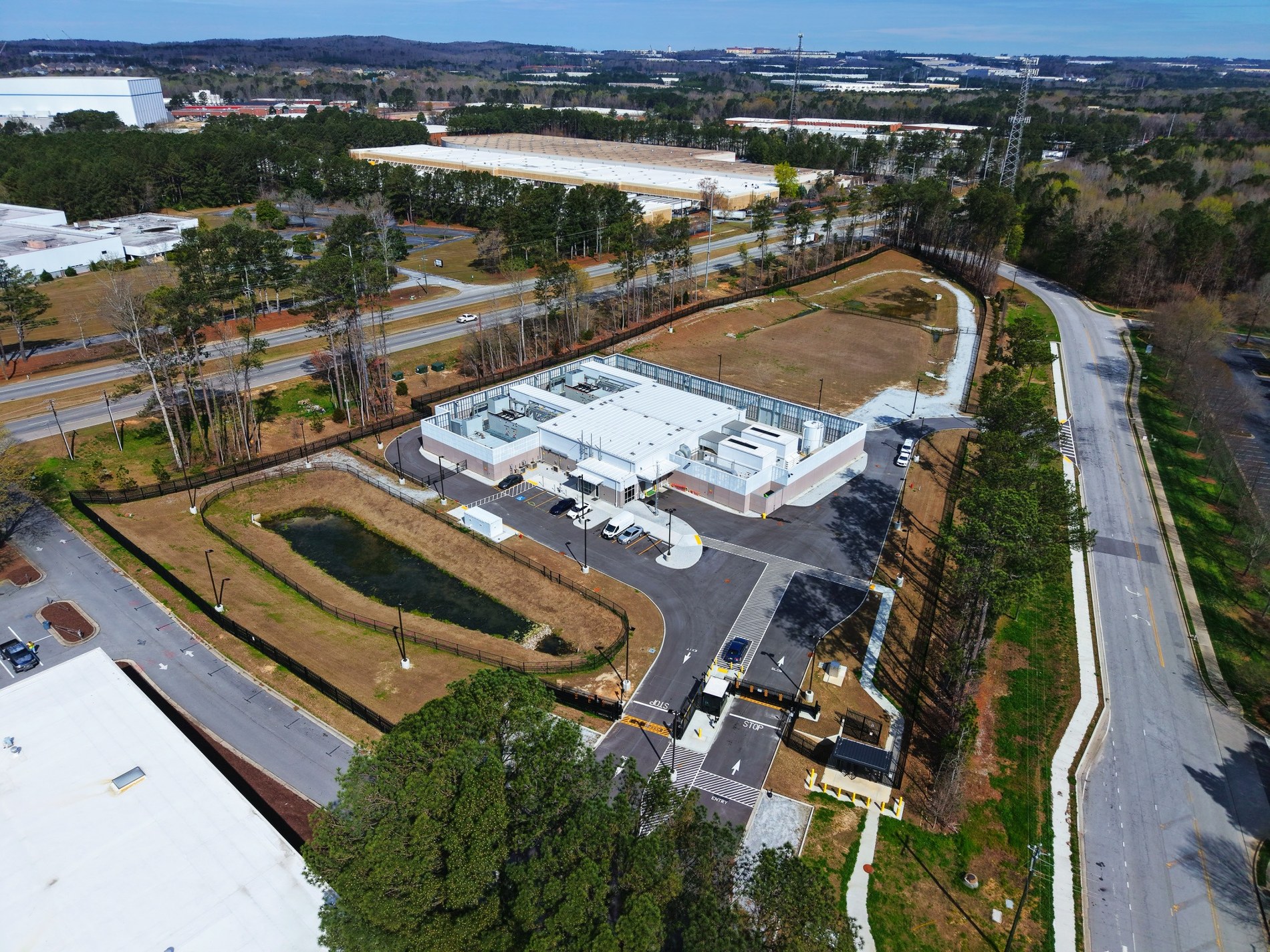 Drone image of industrial facility with surrounding roads